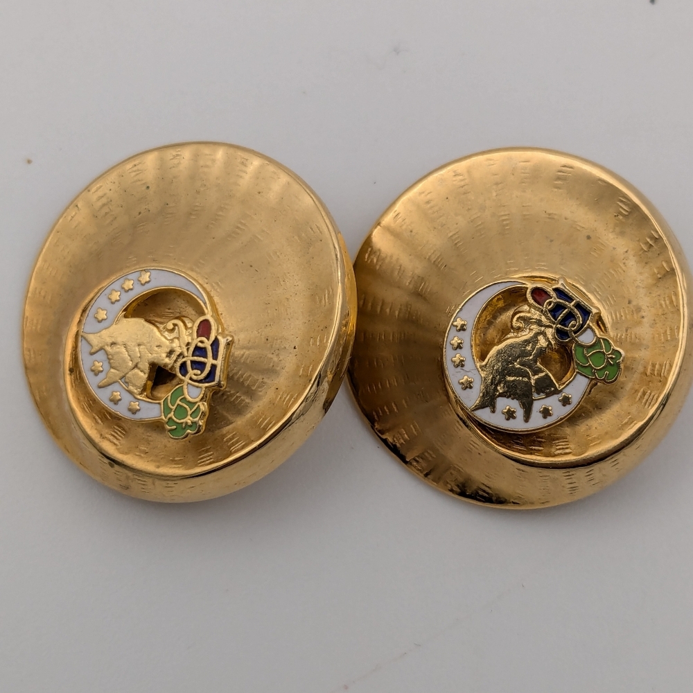 Vintage brushed gold and enamel finish clip on earrings with Rebekah emblem
